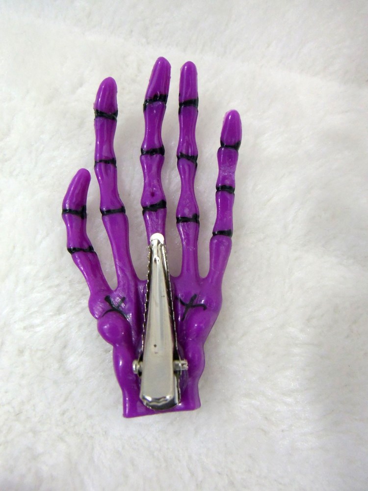 Pince clip à cheveux main de squelette os plastique noir