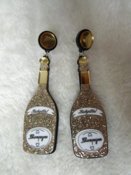 Boucles d'oreilles rétro pin-up bouteilles de champagne dorées