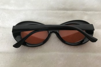 Lunettes de soleil rétro années 60 ovales noires